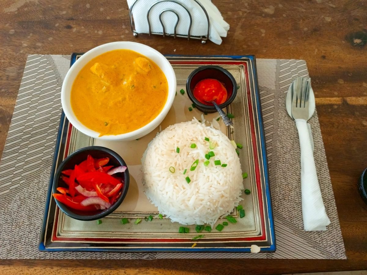 Chicken rezala in a creamy white gravy served with basmati rice